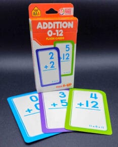 Addition 0-12 flash cards with cards saying "0+0", "3+5" and "4+12" in front.